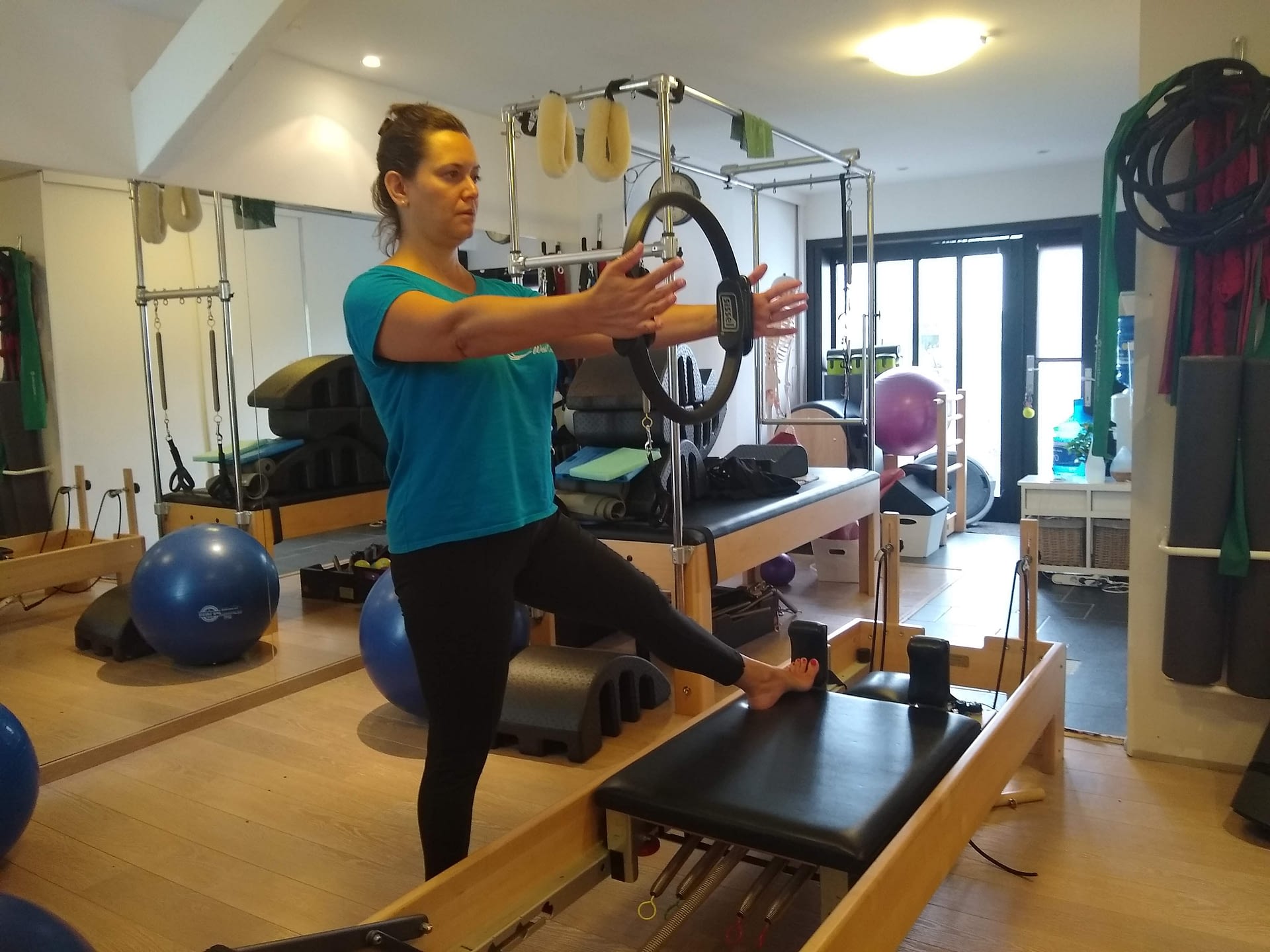 Feet In Straps on the Reformer  Pseudo-Closed Chain Exercise
